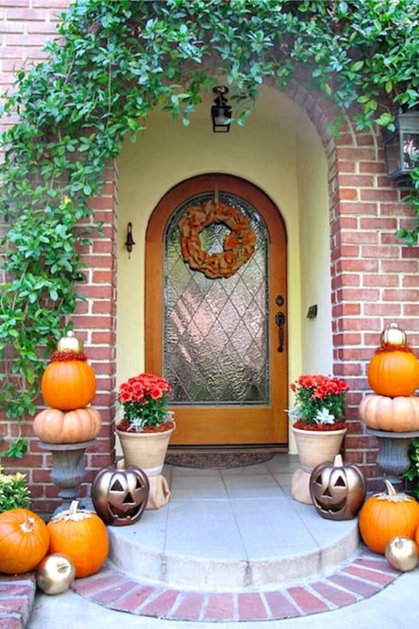 cute fall porch with gold pumpkins