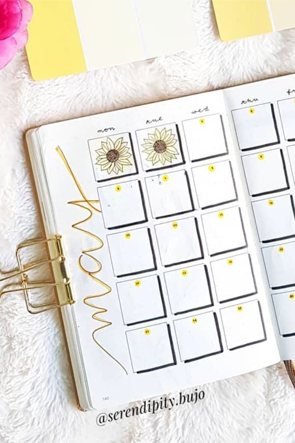 yellow monthly spread with flowers