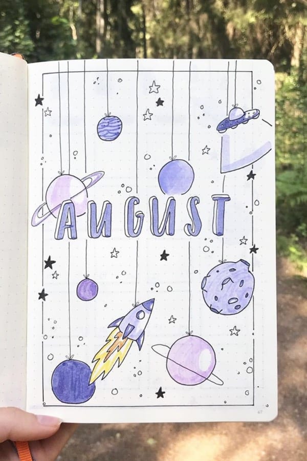 monthly cover page with planet doodles
