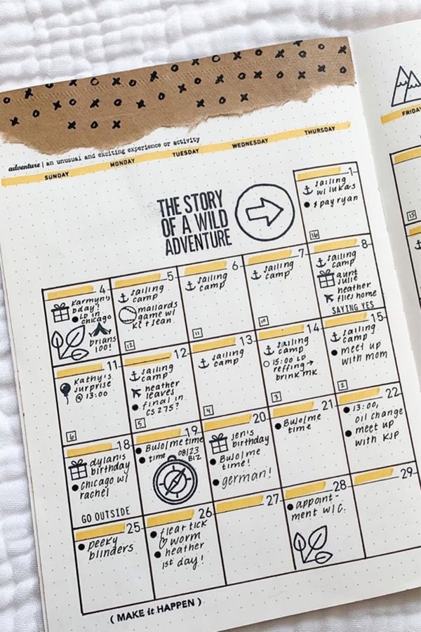 bullet journal monthly spread with yellow headers