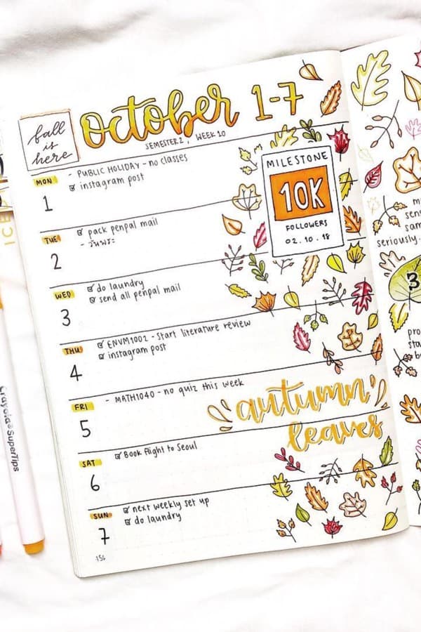bujo spread with autumn leaf doodles