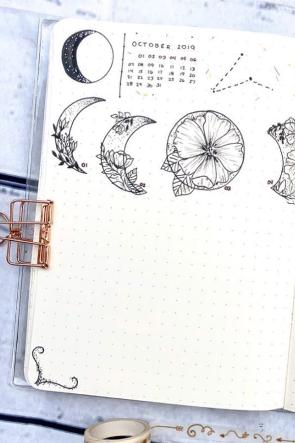 october bullet journal spread with moon theme