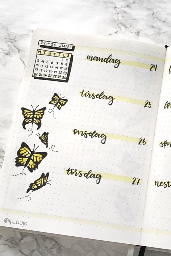 cute bullet journal spread with yellow butterfly