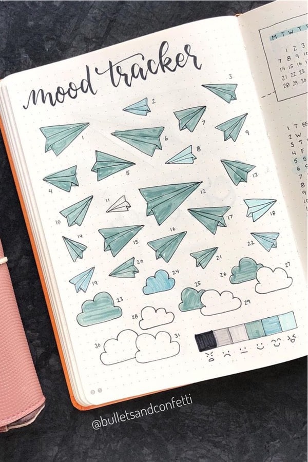feelings tracker with paper plane doodles