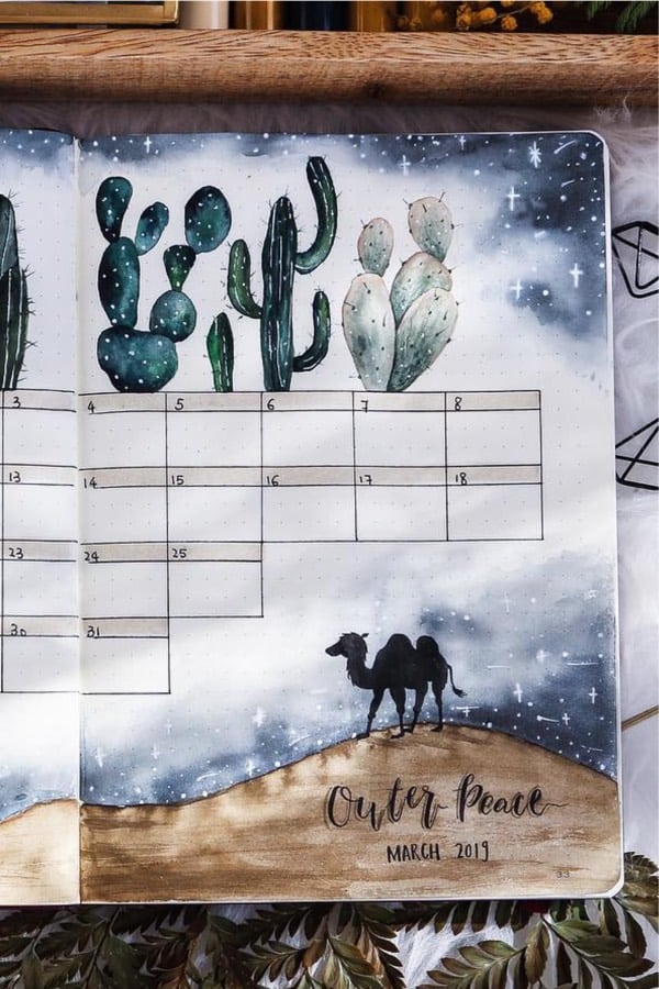 bujo monthly layout with cactus doodles