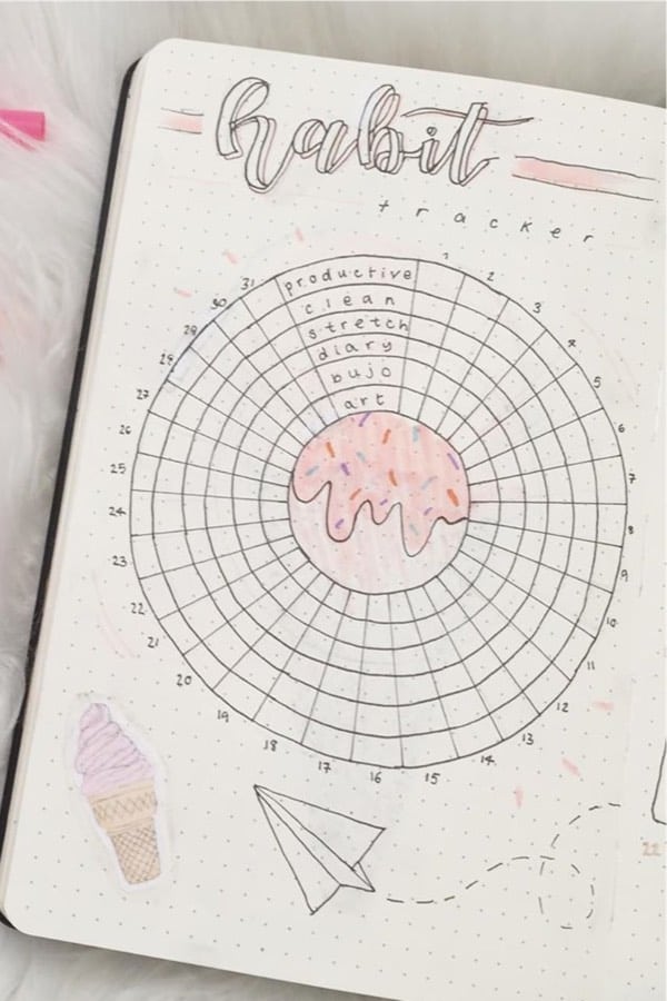 journal tracker with pink paper plane