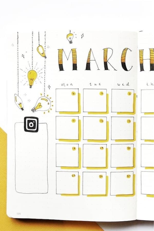yellow monthly spread with hanging light bulbs