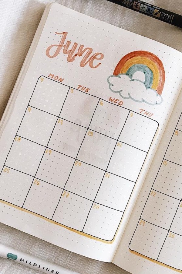 june bujo spread with rainbows