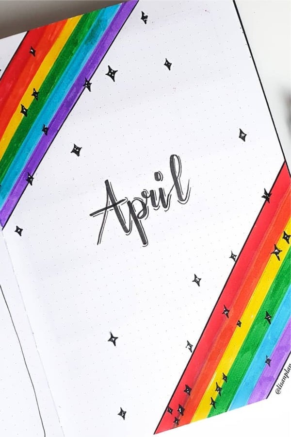 bullet journal cover with rainbow drawing