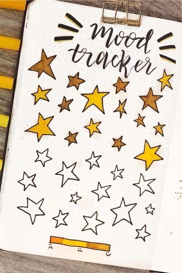 bullet journal tracker with yellow star decoration