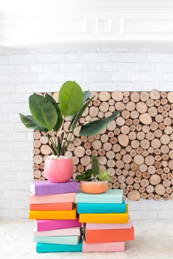 colorful indoor planter stand from old books