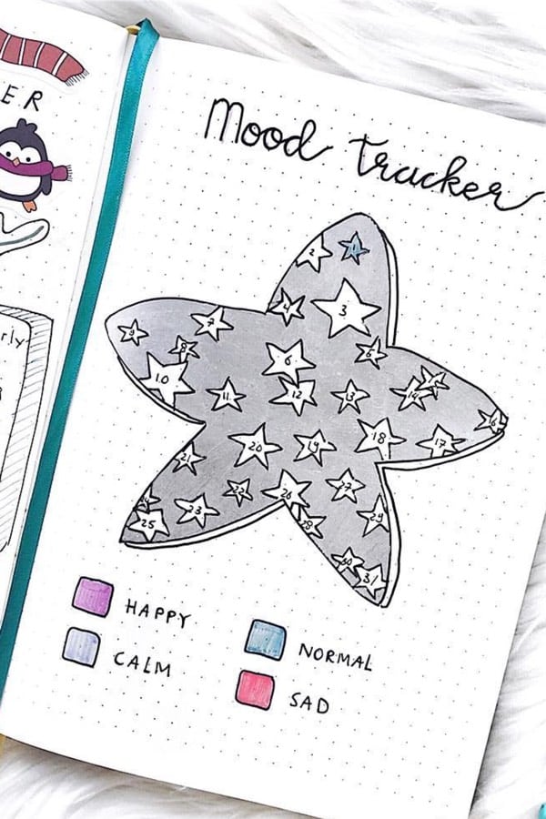 bullet journal tracker with silver stars