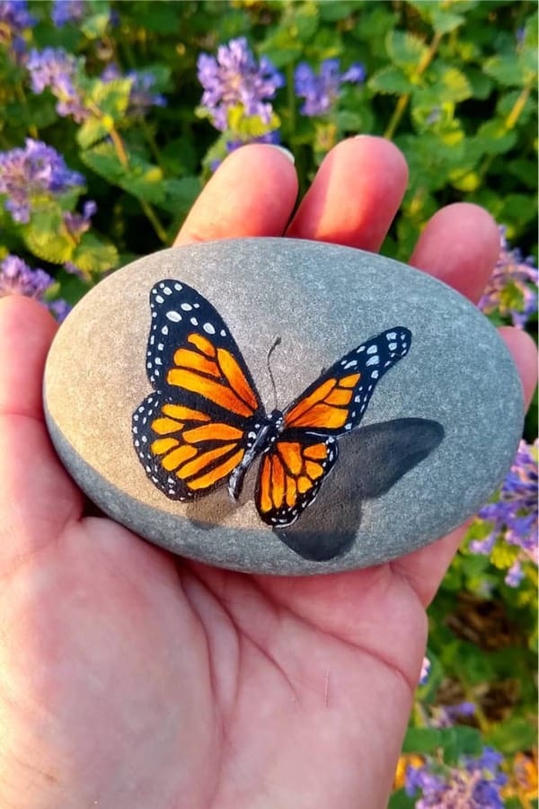 painted rock with butterfly theme