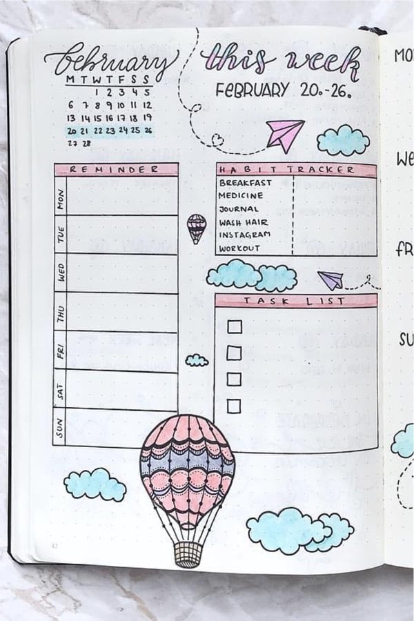 bullet journal tracking spread with clouds