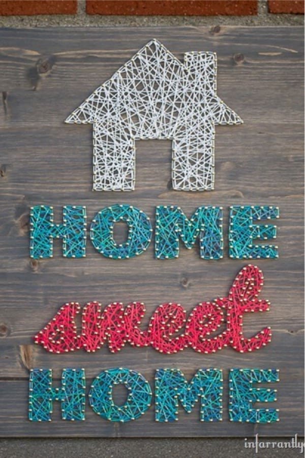 home sign with nail and string