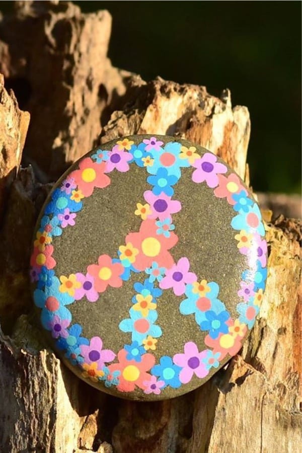 smooth stone with painted flower design