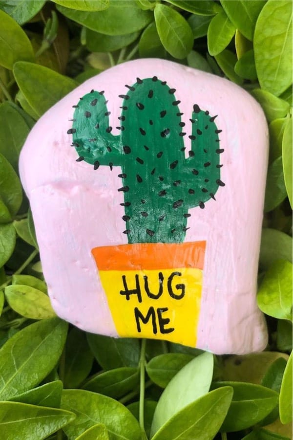 pink painted rock with cactus theme