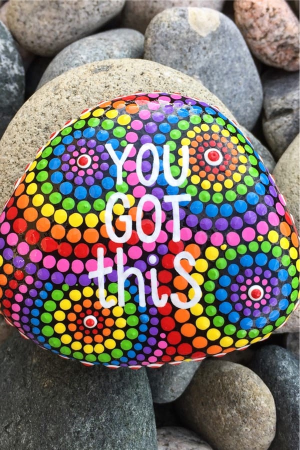 colorful painted stone with inspirational quote