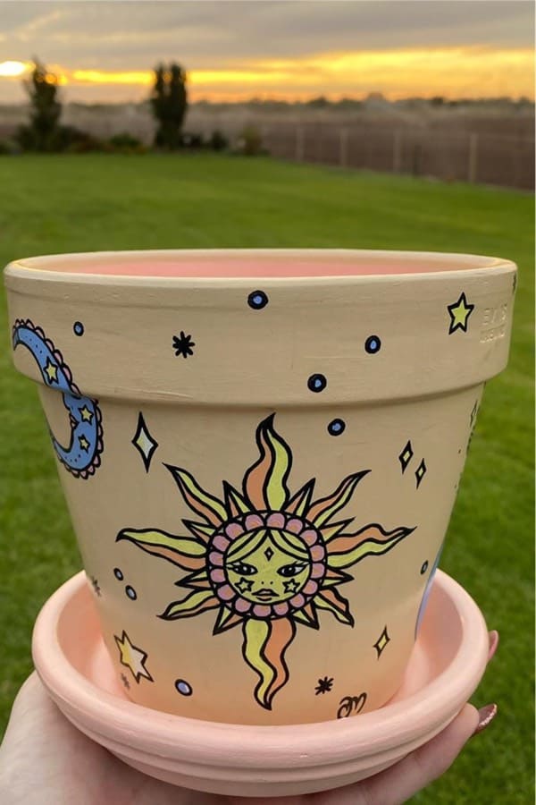 sun and moon themed clay pot design