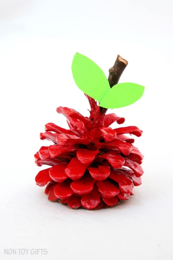 apple craft for kids with pinecones