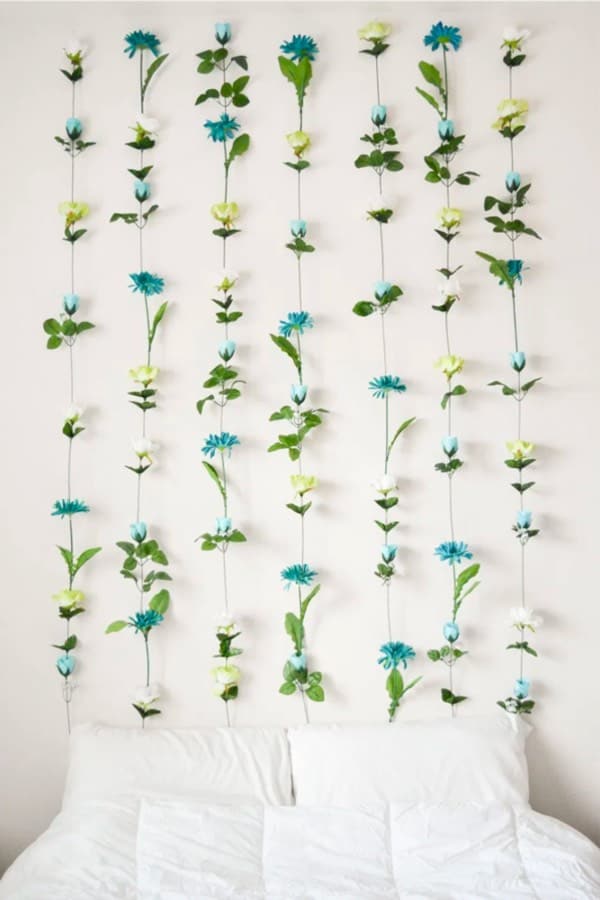 flower wall art behind bed