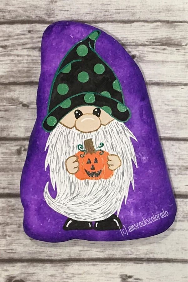 painted rock with halloween gnome