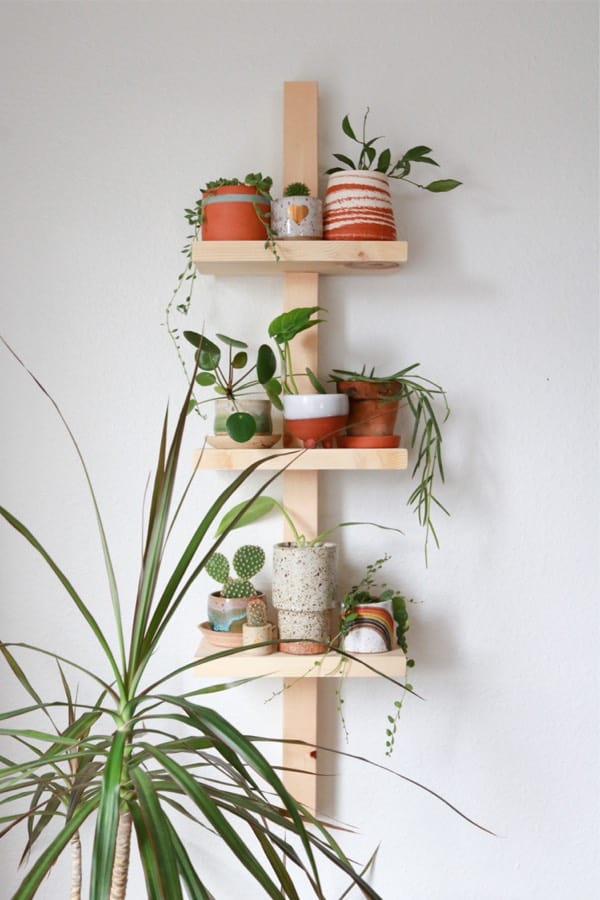 diy wooden plant shelf on wall