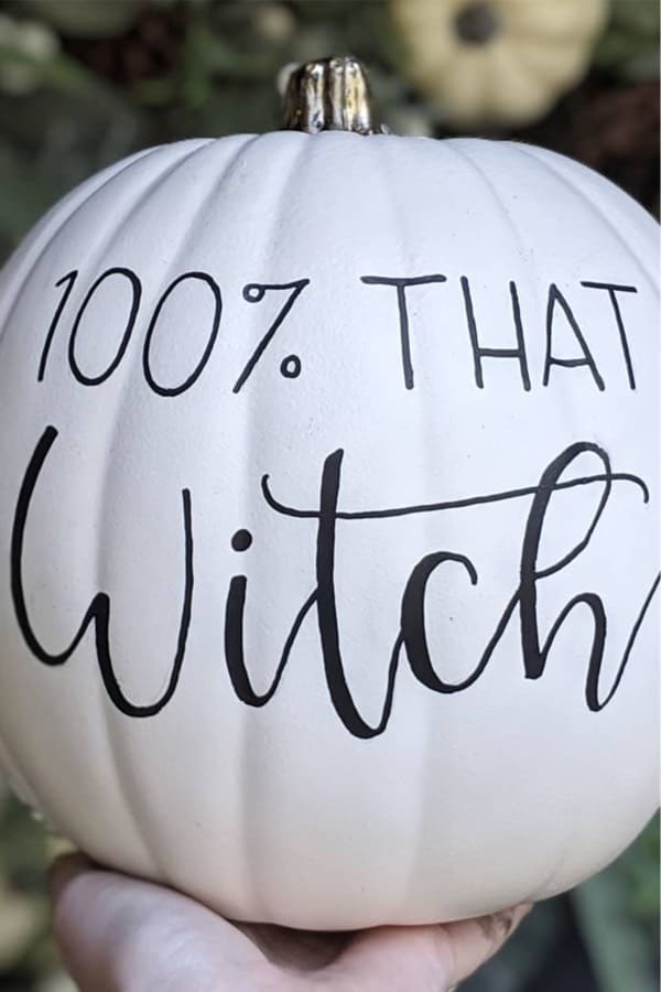 white pumpkin decoration with lettering