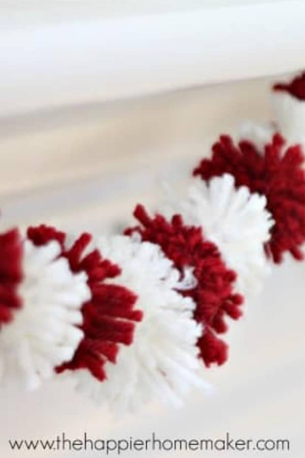 red and white pom pom garland decoration
