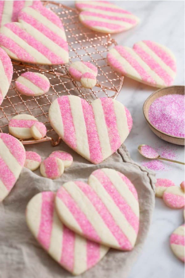 pink and white stripped heart shaped cookies