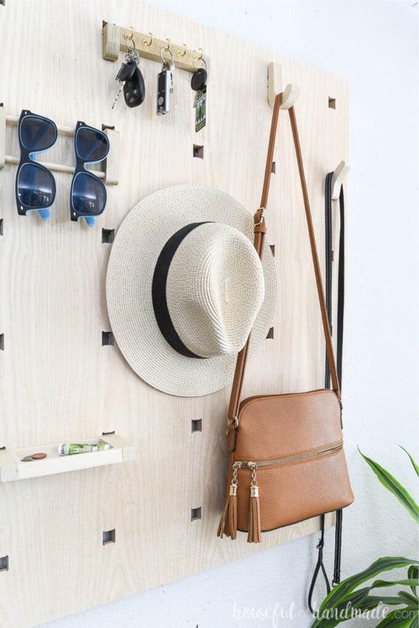 large pegboard organizer for entryway