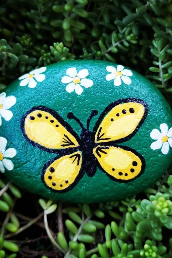 rock painting example with yellow butterfly