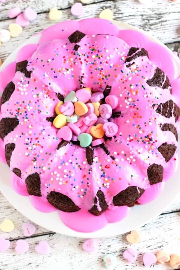 pink bundt cake with conversation hearts