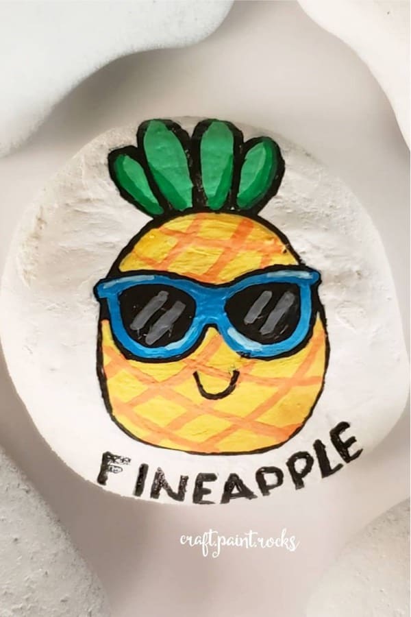 cute painted stone with pineapple face