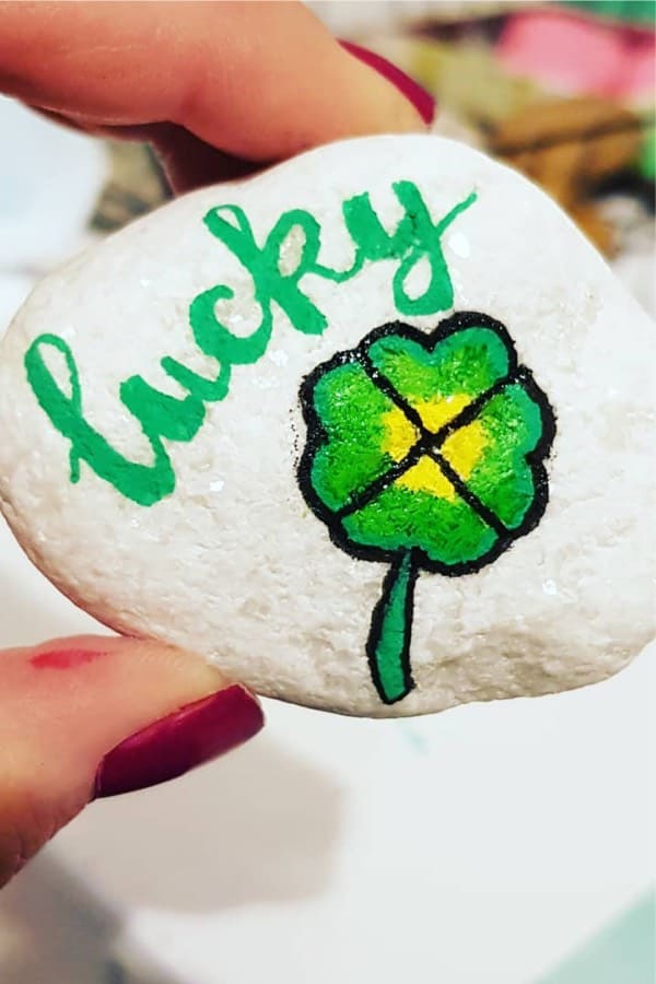 painted stone with four leaf clover
