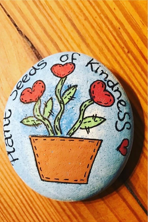 simple rock painting example with red flowers
