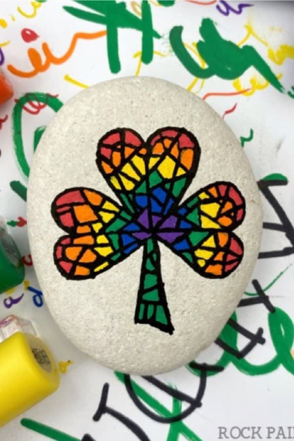 hand painted pebble with rainbow mosaic