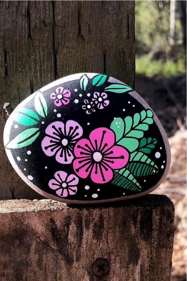 hand painted flowers on rock