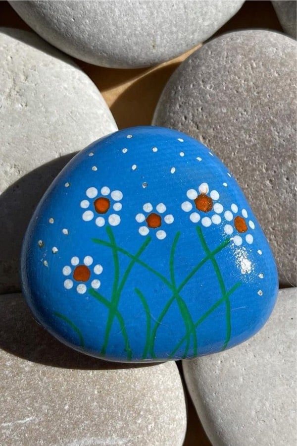 pebble painting design with easy flowers