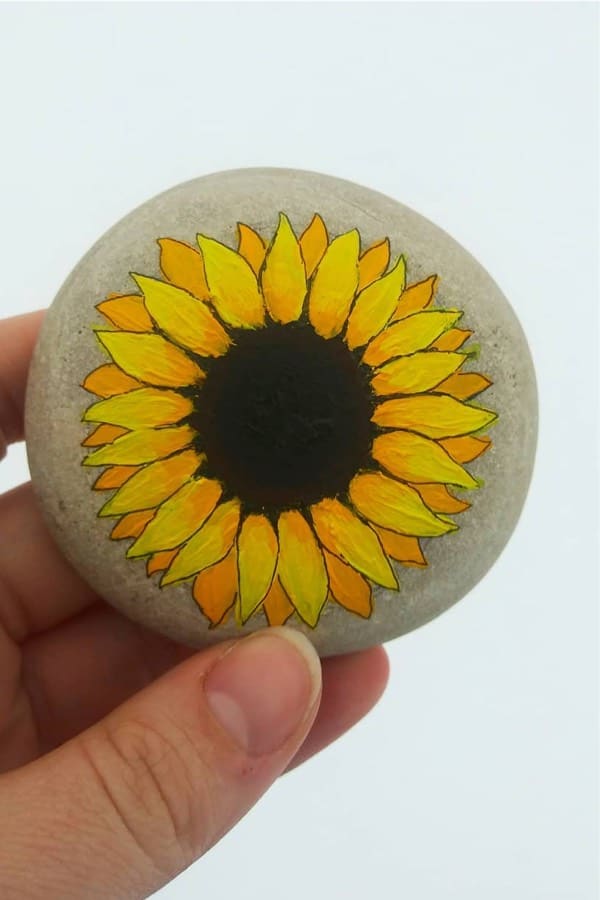 painted kindness rock with sunflower design