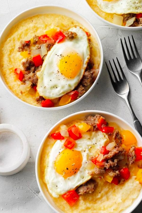SAUSAGE AND EGGS OVER CHEDDAR-PARMESAN GRITS