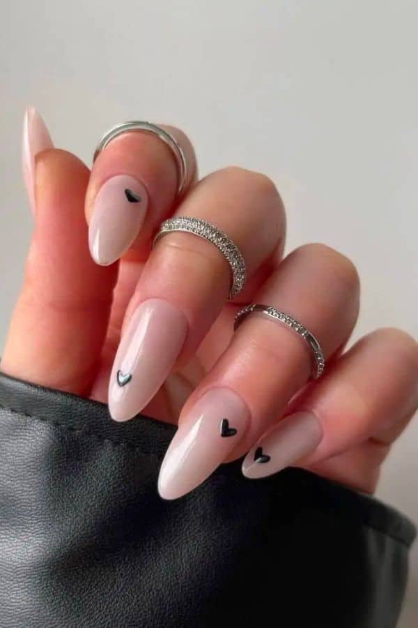 MILKY WHITE NAILS ADORNED WITH BLACK HEARTS