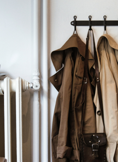 Coats and shoulder bag on hooks in house