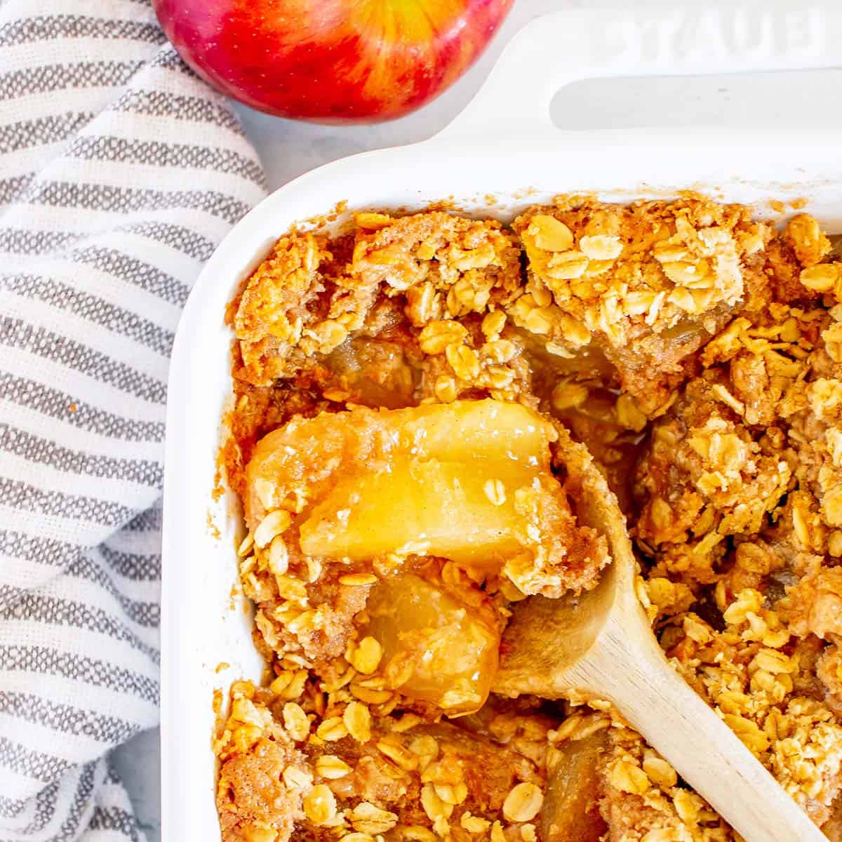 Cake-mix apple cobbler in a baking dish with a golden, oat-flecked topping