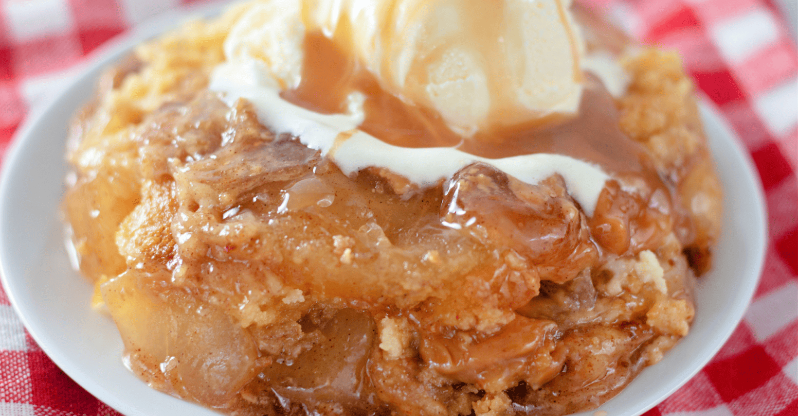 Plated caramel apple dump cake with caramel sauce