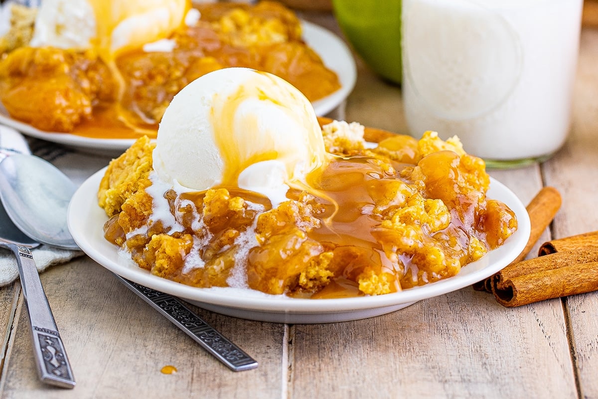 Caramel apple dump cake with cinnamon, nutmeg and a buttery topping
