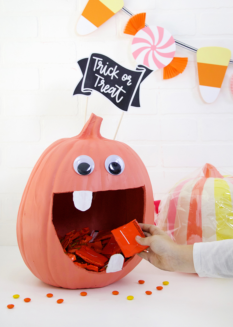 Craft pumpkin candy bowl with a playful face ready for Halloween treats