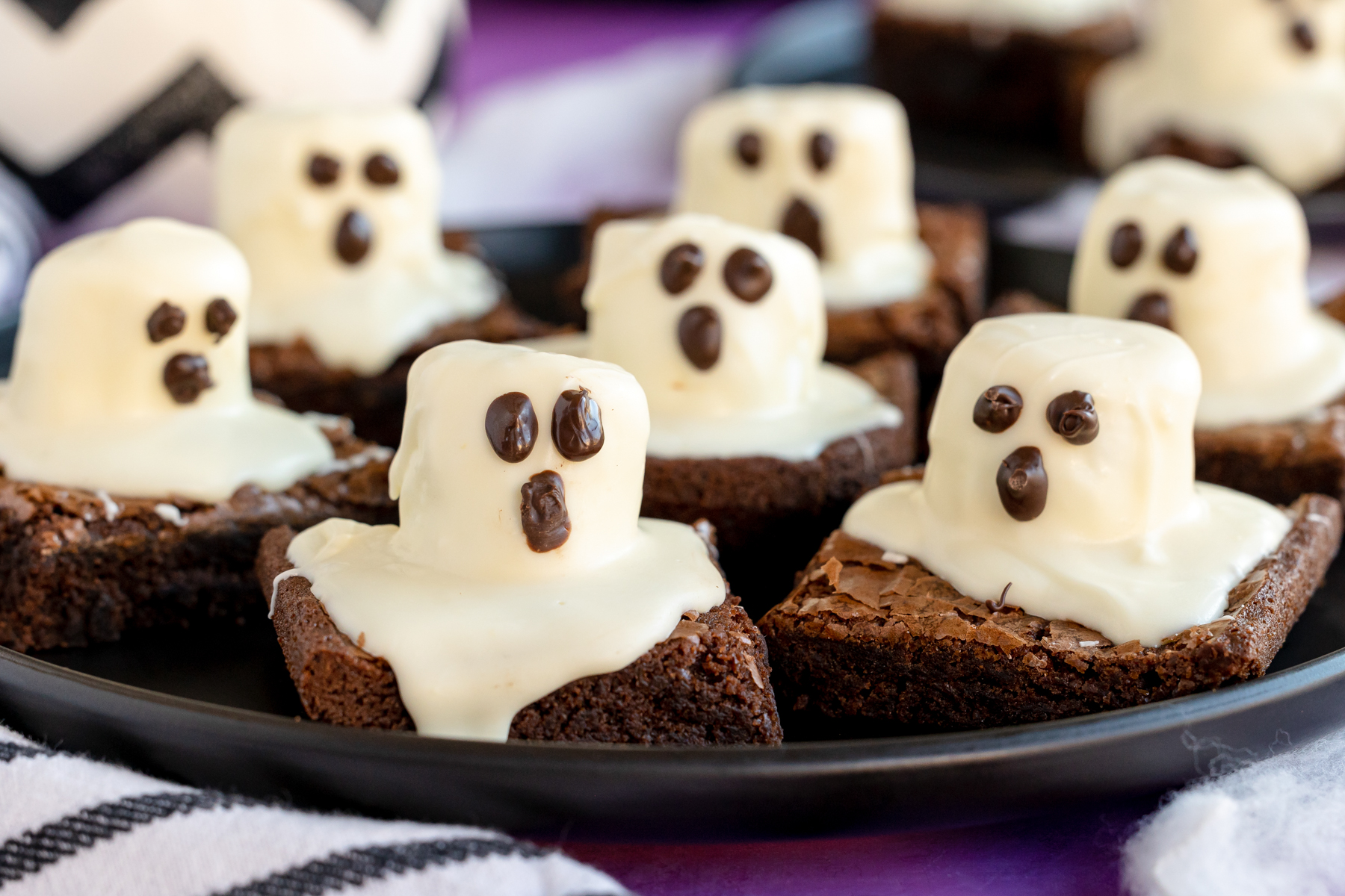 Ghost brownies and Halloween desserts with marshmallow ghosts on brownie squares