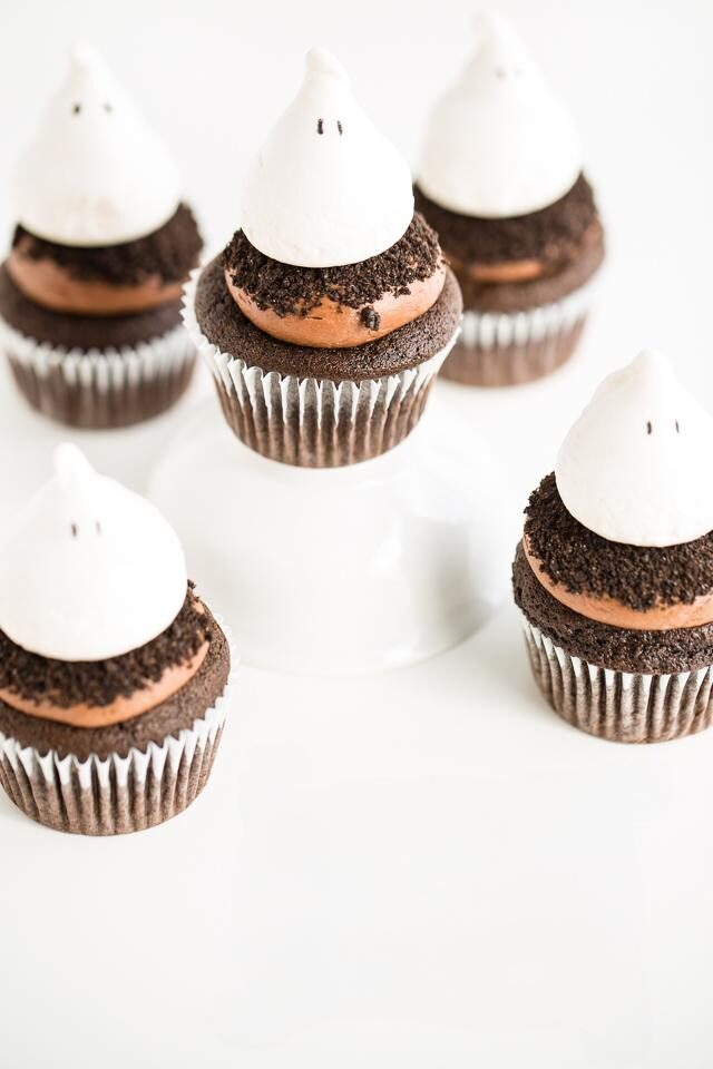 Halloween ghost cupcakes with chocolate bases and meringue ghost toppers